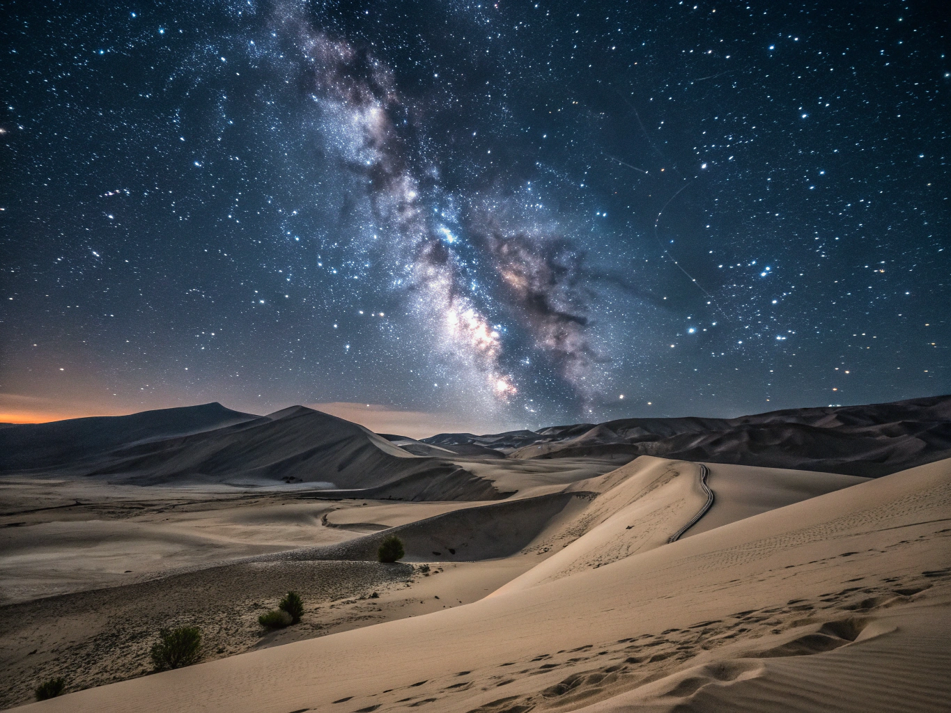 Dunes under a dense star-filled desert sky